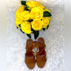 Brown heeled sandals.